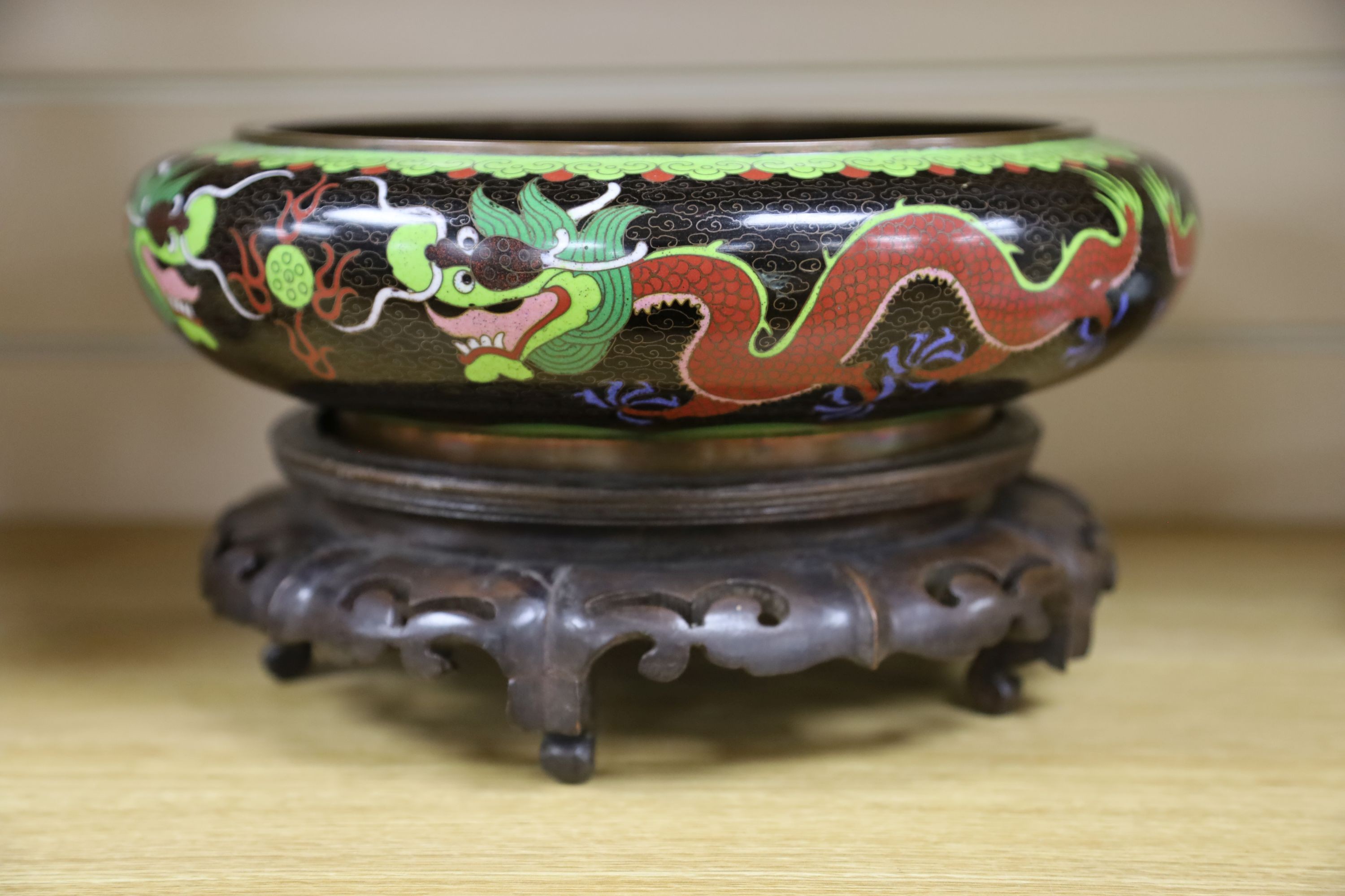 A large early 20th century Chinese cloisonné enamel ‘dragon’ bowl and two Chinese Tongzhi celadon ground famille rose bowls 31cm